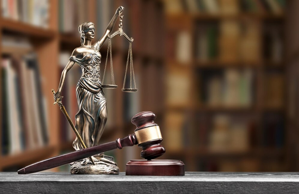 Gavel on a table with Lady Justice