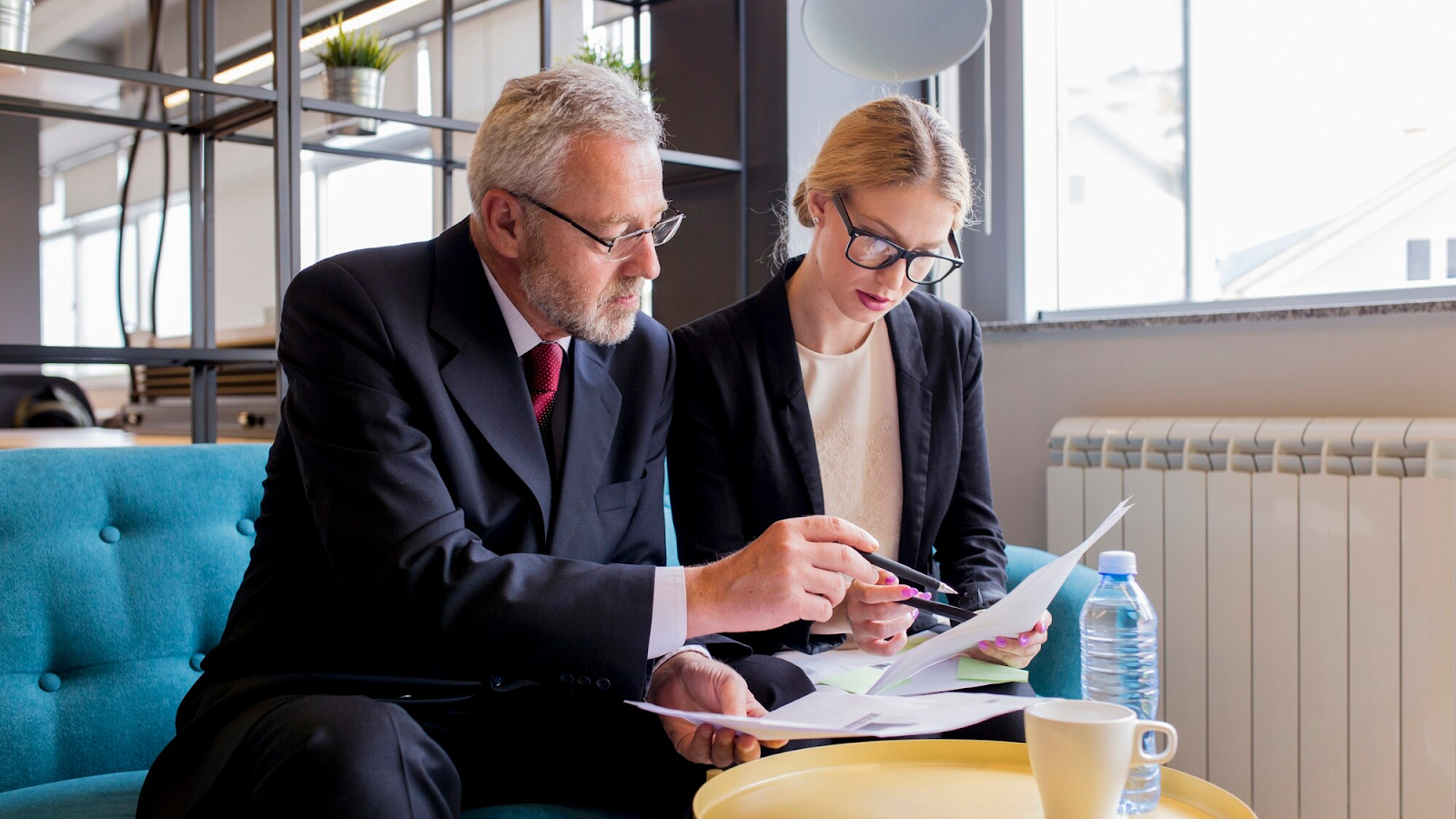 Two business people discussing contract in the office